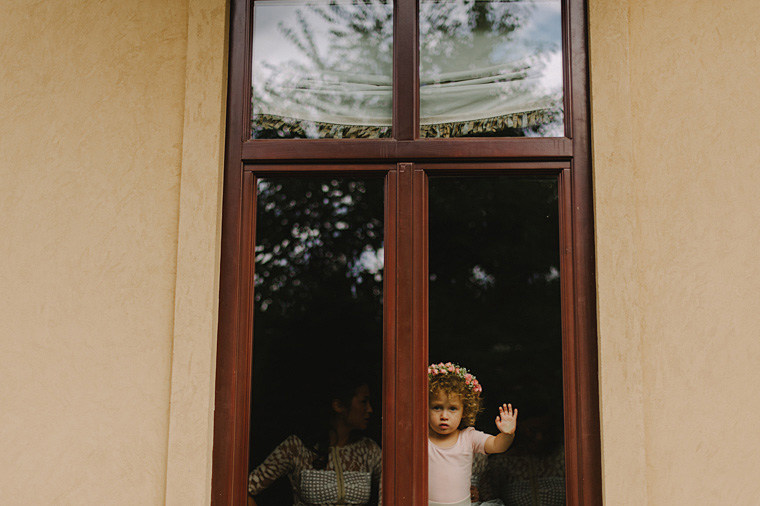 flower girl peeking out the window