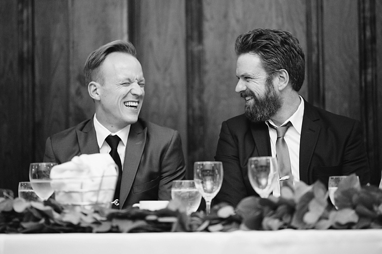 groom laughing during wedding reception