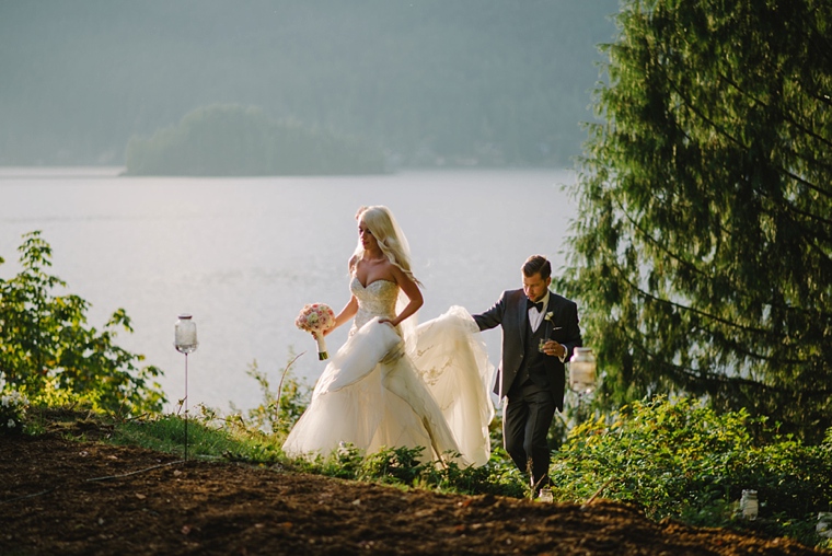 bride and groom walking at sunset