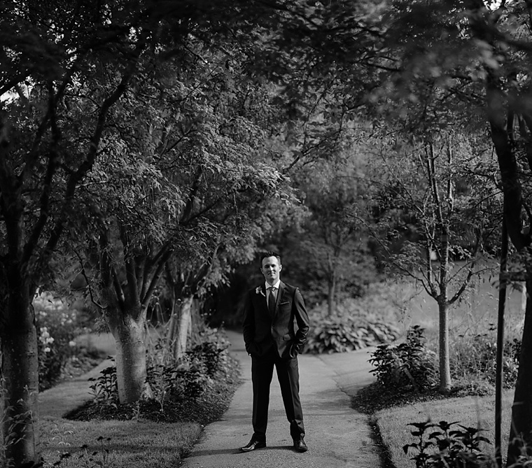 black and white portrait of a groom