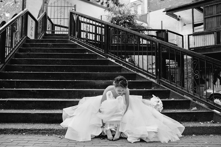 bride sitting in alley