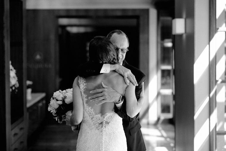 father embracing his daughter before wedding
