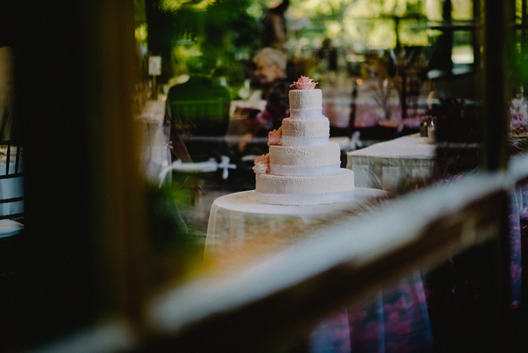 pink flowers on a white cake made in vancouver