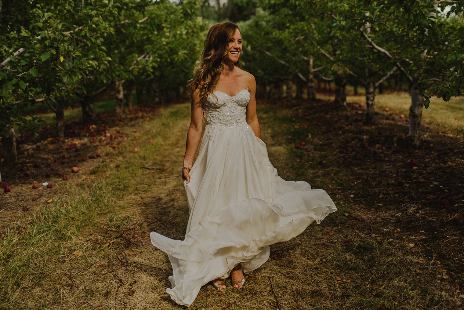 bride dancing in flowy dress