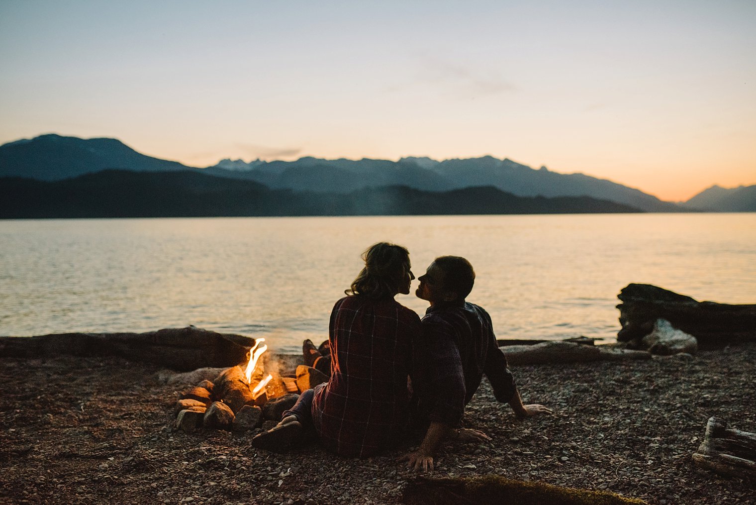 campfire engagement session at harrison lake