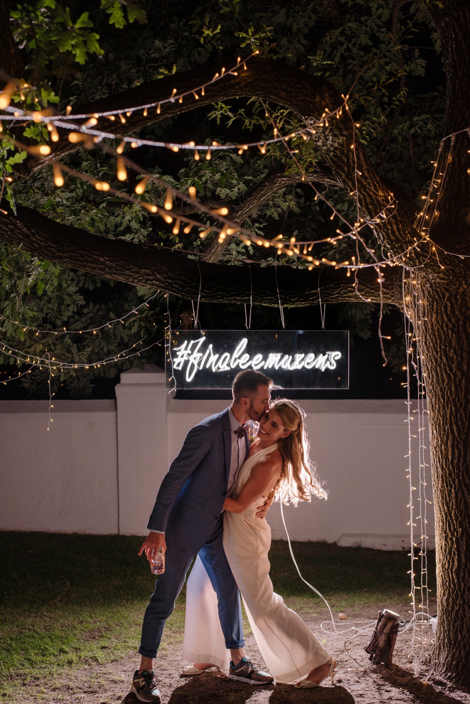 wedding portrait with neon sign